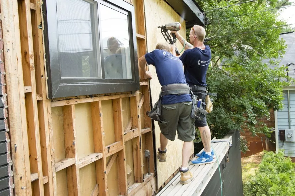 Professional siding installation in Hermon on a residential home with new vinyl siding