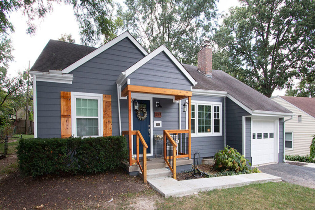 Professional siding installation in Hermon on a residential home with new vinyl siding